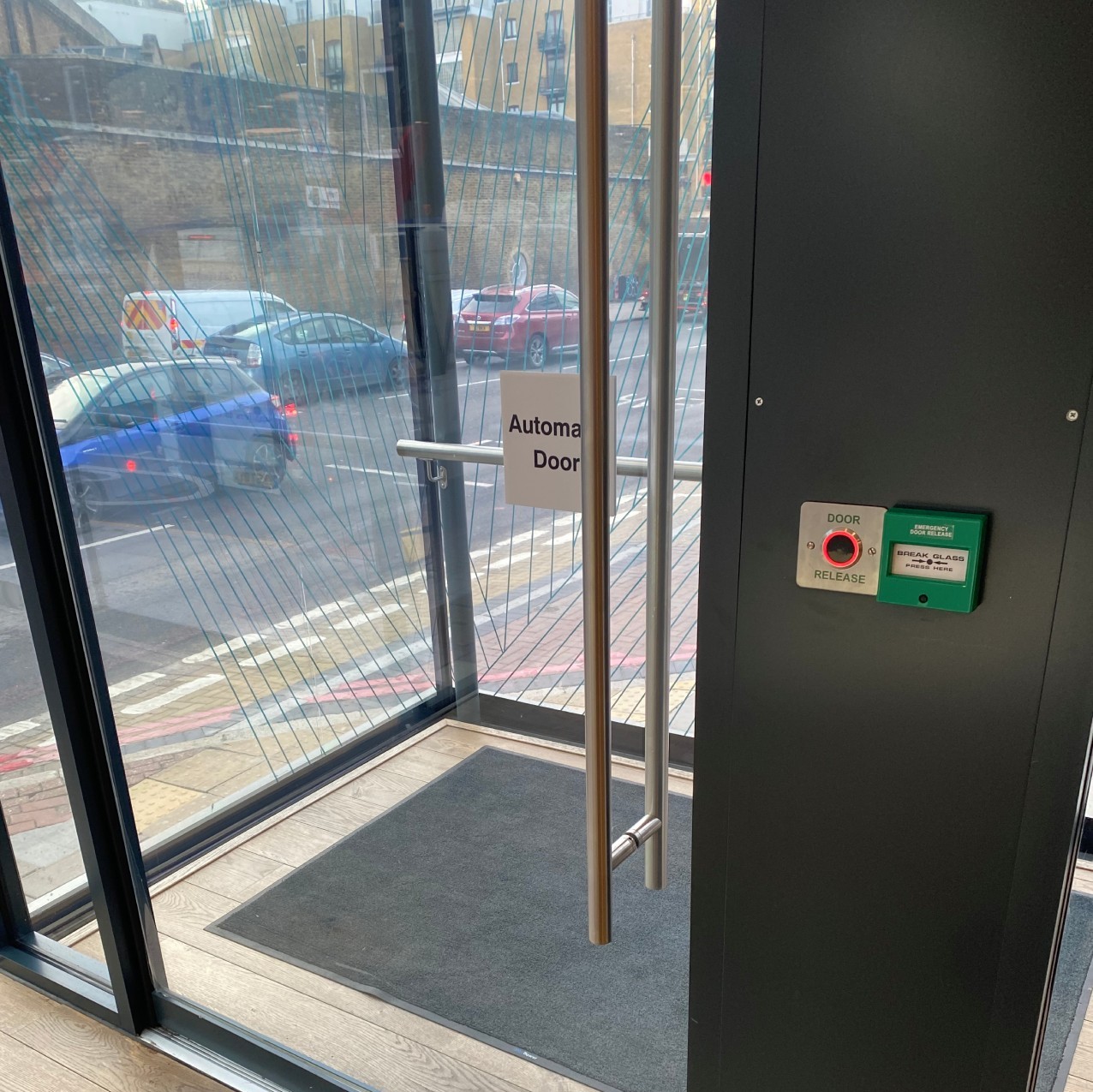 View of internal front door showing contactless door release pad on the right hand side