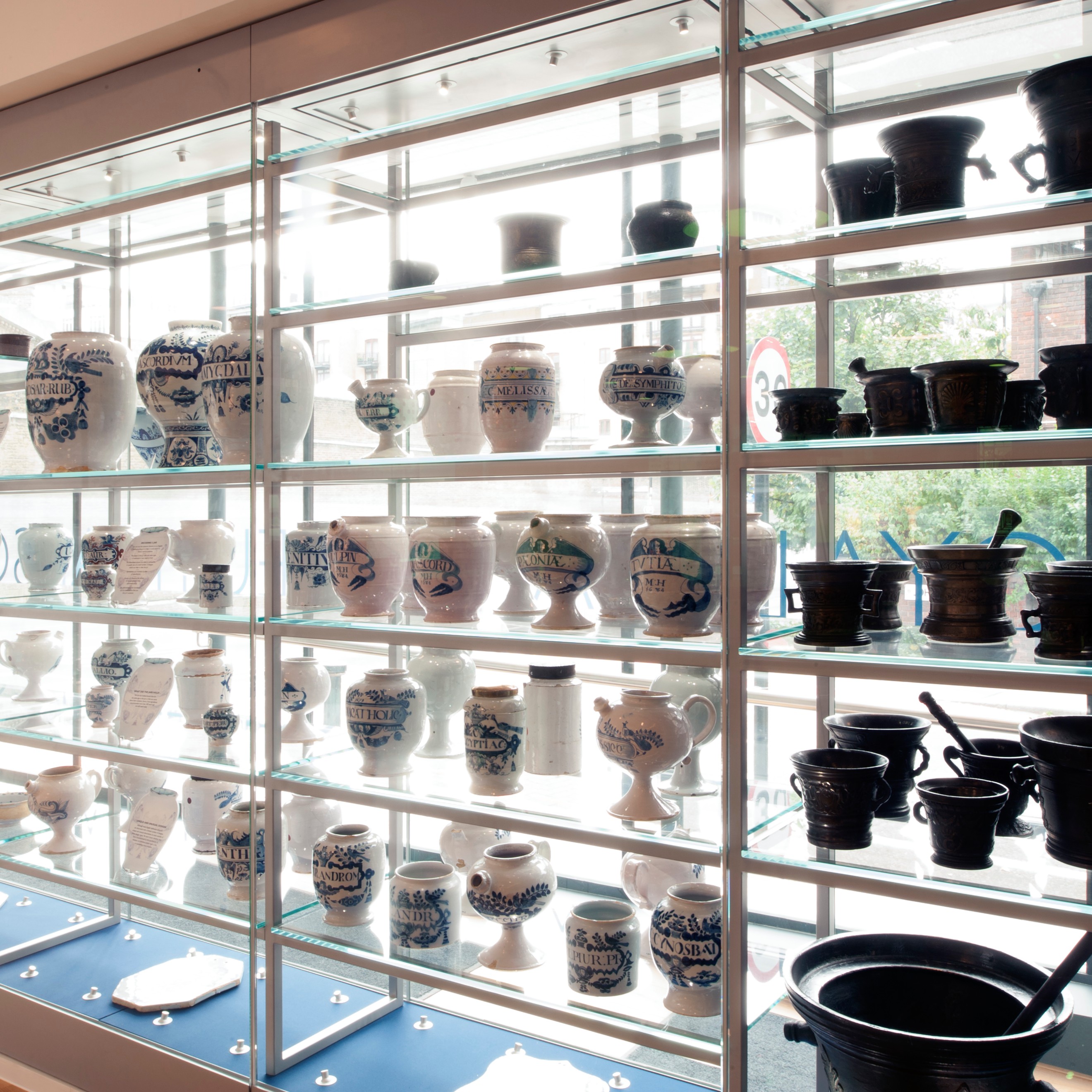 View of delftware apothecary jar display showing many shelfs of blue and white jars