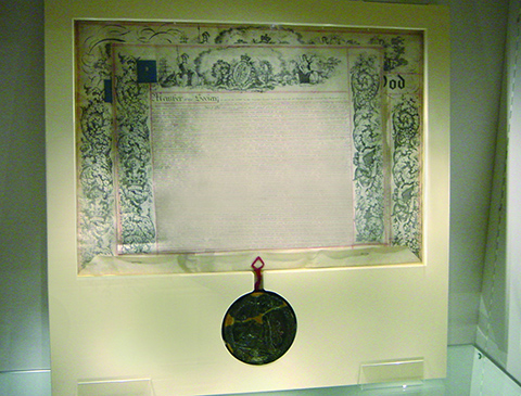 The beautifully decorated Royal Charter, with its wax seal. This gave the Society government support, securing its place to represent the profession